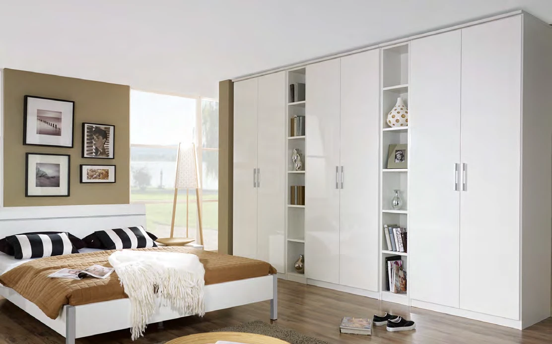 White hinged wardrobe with long doors and a central open shelving section