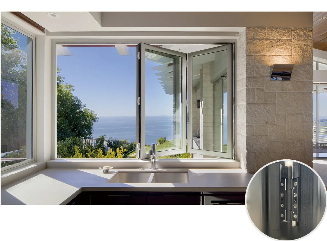 Corner kitchen window with folding glass panels opened above the sink