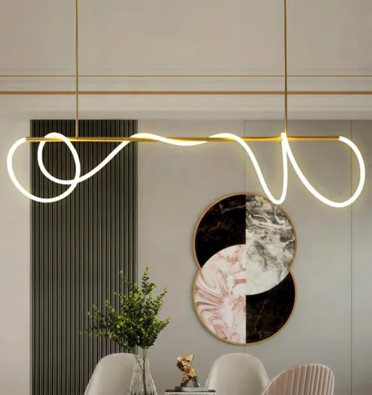 Ring-shaped pendant light above a table in a catalogue interior