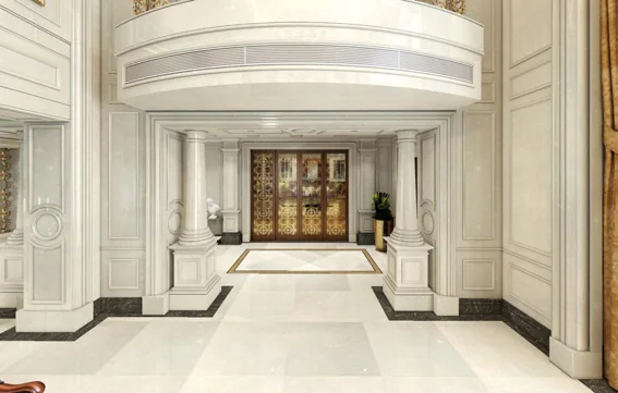 Pale marble floor and wall panels with dark borders in a catalogue interior