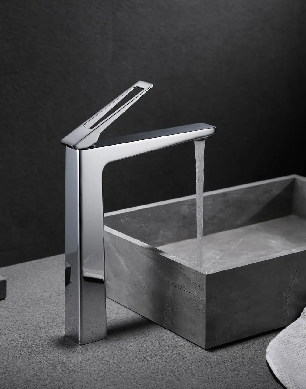 Angular basin tap mounted beside a basin in the tapware catalogue