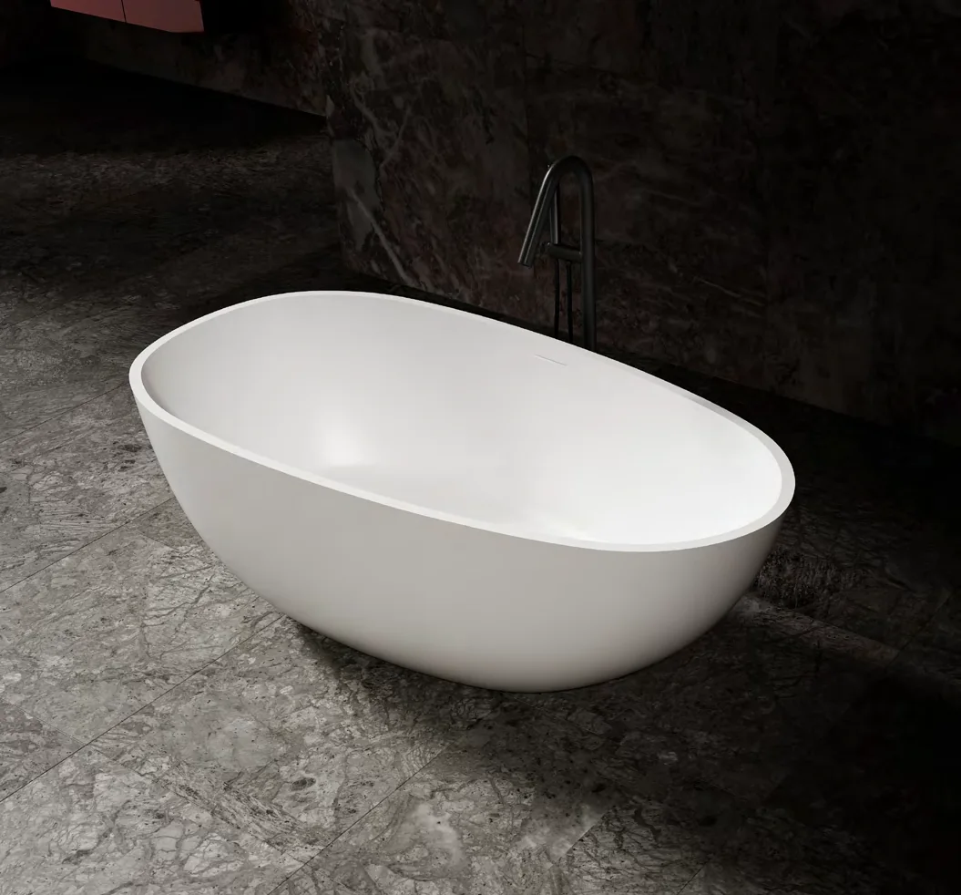 Oval white bath against dark walls in an artificial-stone bath catalogue