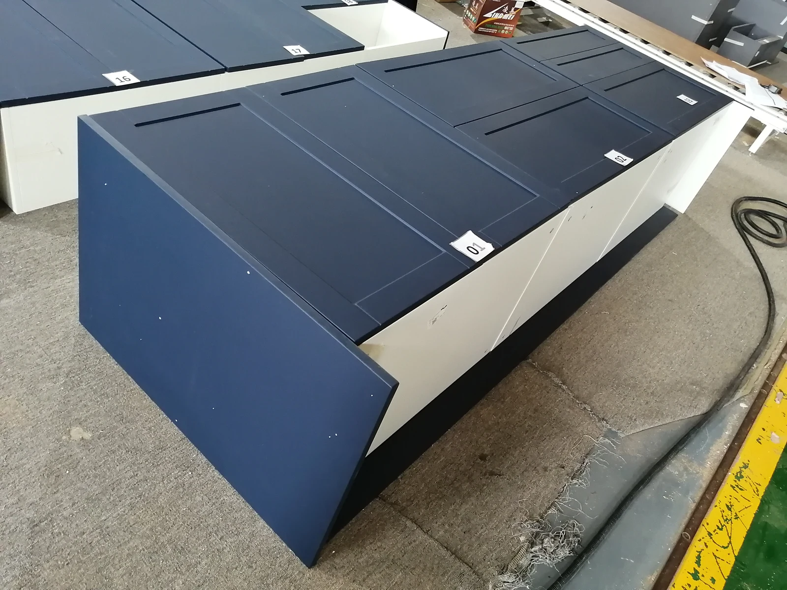 Navy cabinet sections assembled for a trial fit before packing