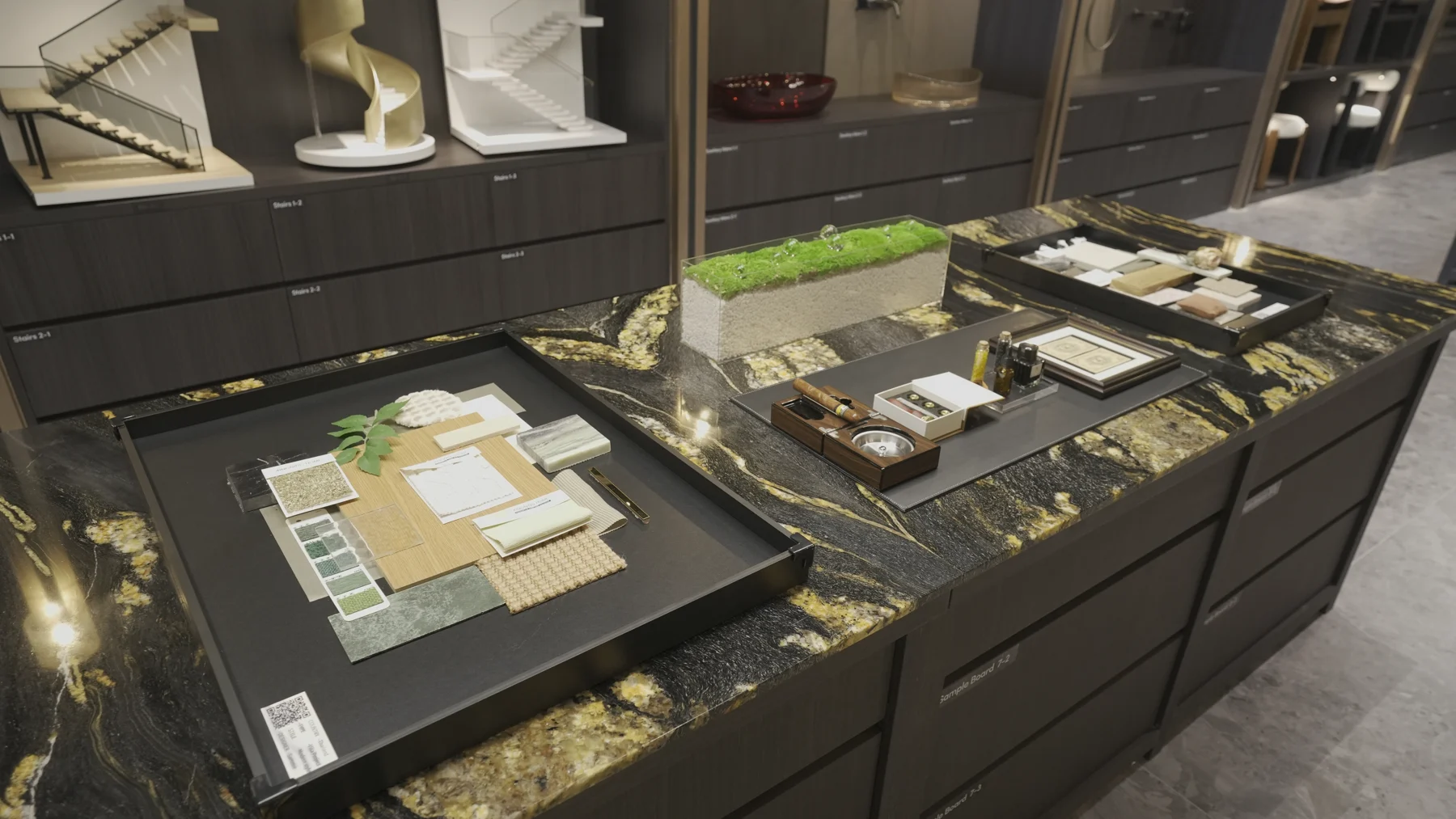 Material sample boards, hardware and finish samples arranged on a stone display counter